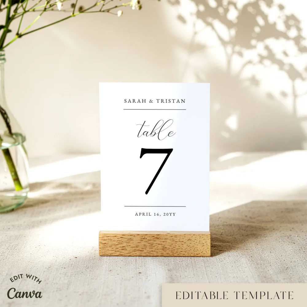 Customisable wedding table number in a wooden stand on table