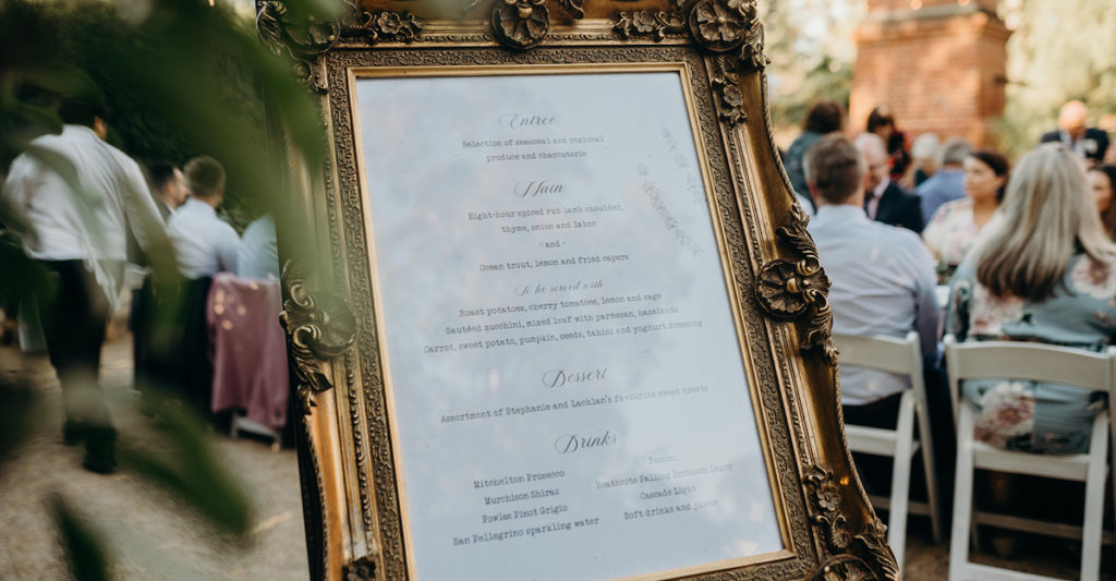 Large menu design in frame by The Hello Bureau. Photography by Tahnee Jade Photography.