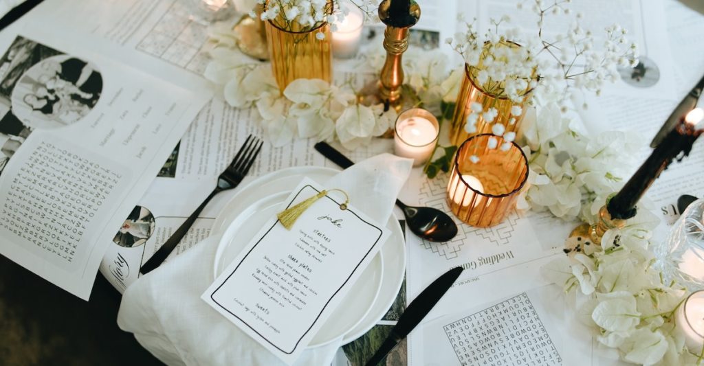 Table styled with newspaper and yellow glassware