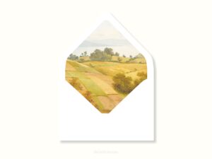 White envelope with a printed liner showing a farm pasture landscape.