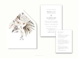 White envelope with a printed liner showing illustrated bohemian florals next to wedding invitations.