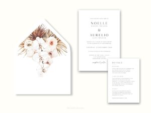 White envelope with a printed liner showing illustrated bohemian florals next to wedding invitations.