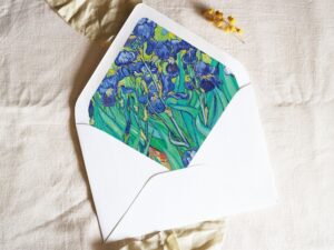 White envelope with a printed liner showing a painted floral bouquet.