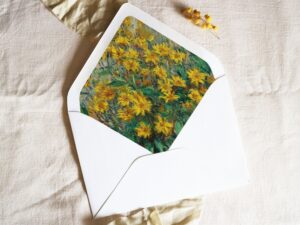 White envelope with a printed liner showing a painted floral bouquet.