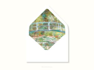 White envelope with a printed liner showing a painted bridge over a pond of water lillies.