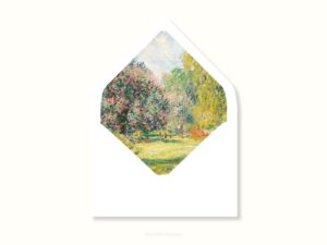 White envelope with a printed liner showing painted forest scene.