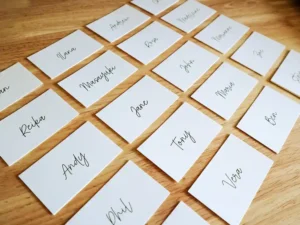 A group of wedding place cards on a table