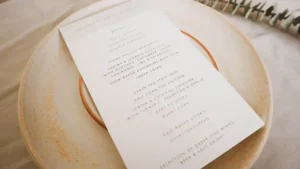 A minimal wedding menu on a stone plate