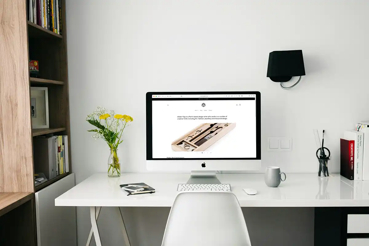 A computer on a desk showing website design in Perth