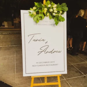 A wedding welcome sign on an easel