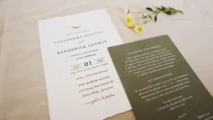 A wedding invitation set on a table