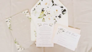 A wedding invitation set on a table