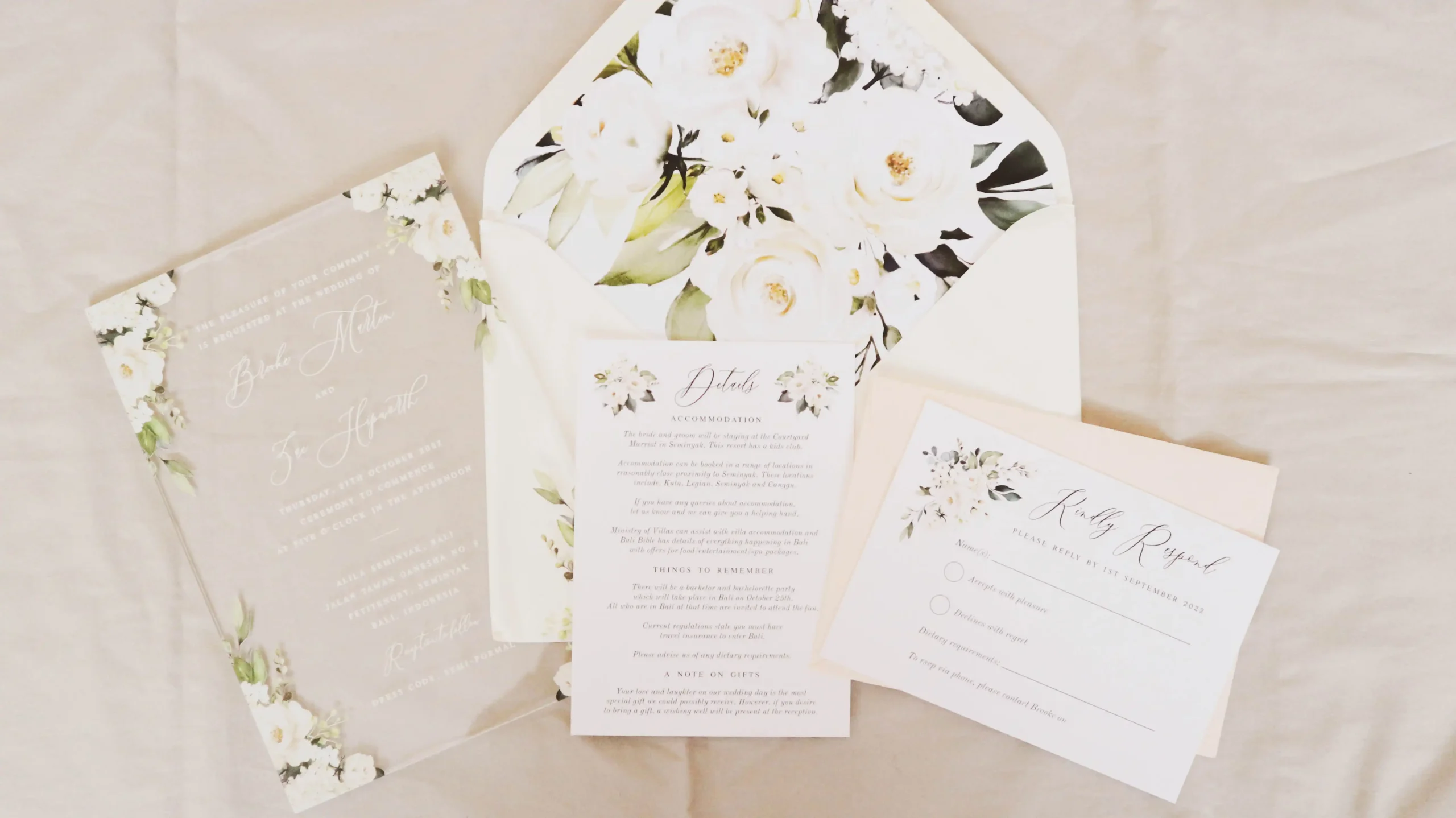 A wedding invitation set on a table