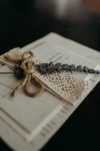 A close up of a lavender sprig on an invitation set