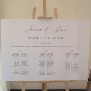 A wedding seating chart sign on an easel