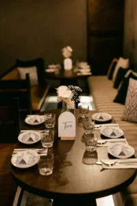 A wedding table setting with an arch table number