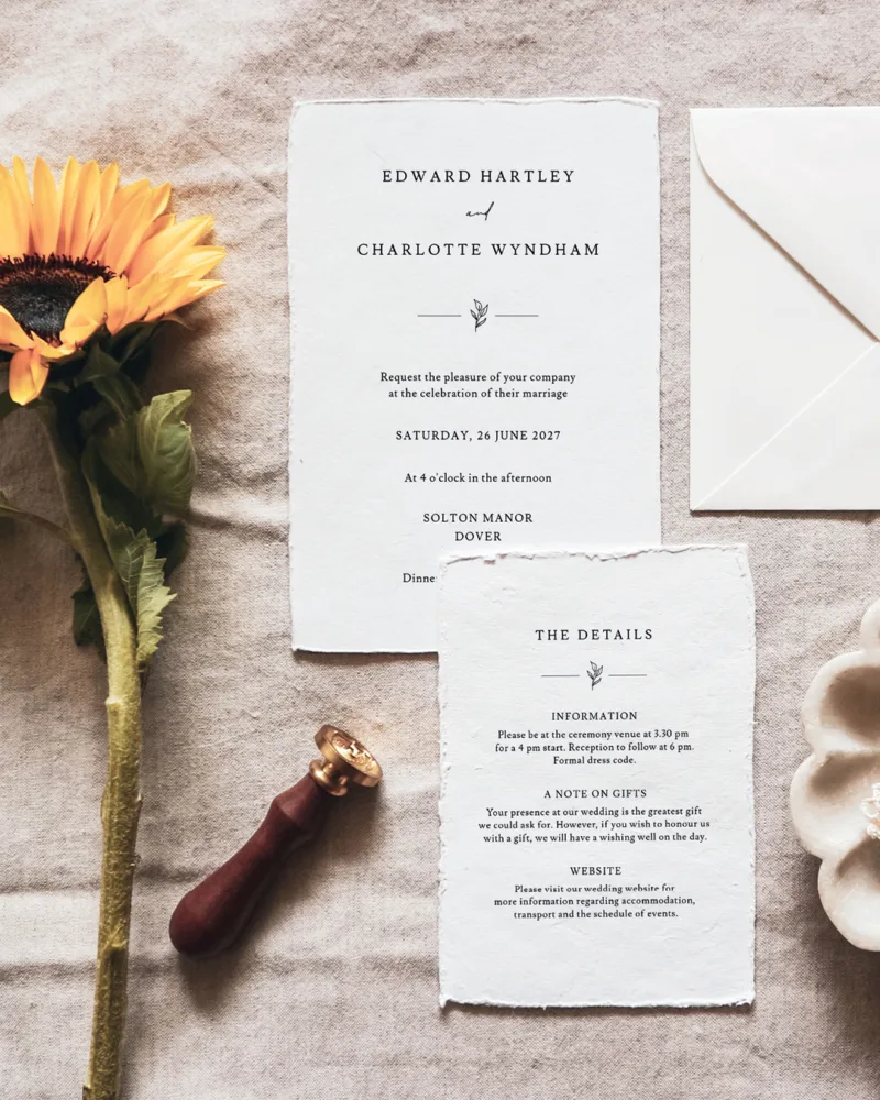 A wedding invitation flatlay with the Melrose design from The Hello Bureau.
