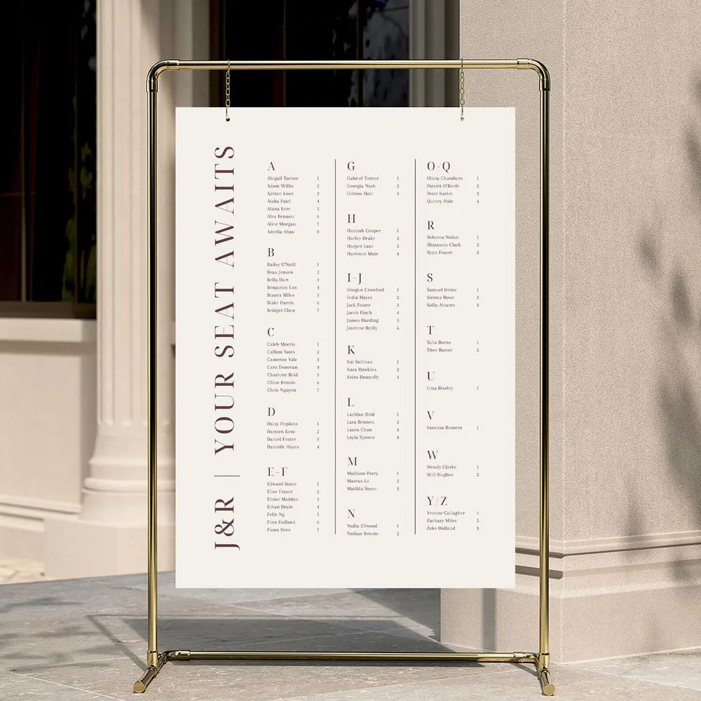 Modern alphabetical wedding seating chart template listing guests A to Z, displayed on a gold stand.