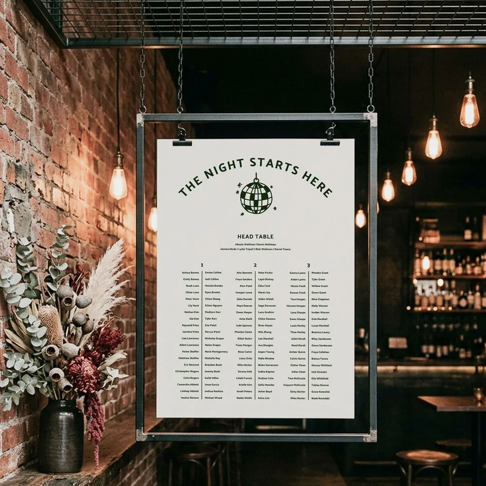 Informal wedding seating chart template for 3 long tables with a disco ball design, hung between string lights at an industrial venue.