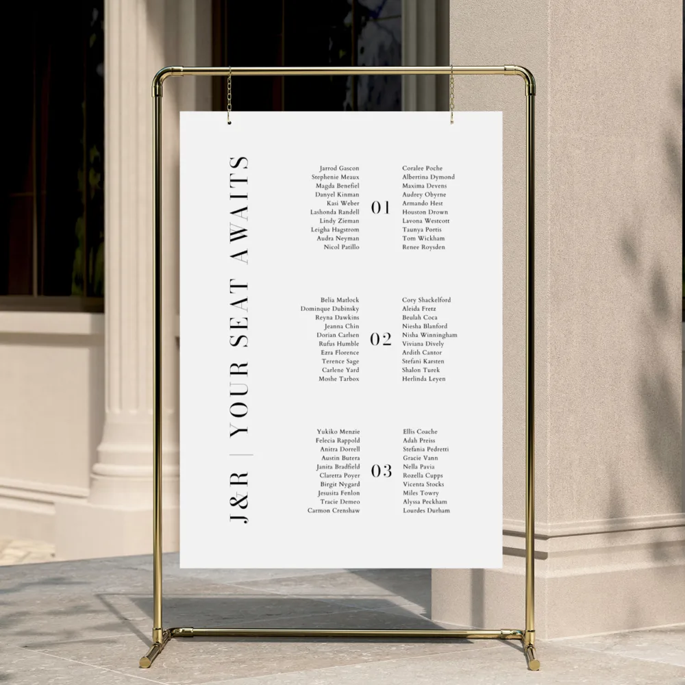 Modern long tables seating chart hanging on a golden frame