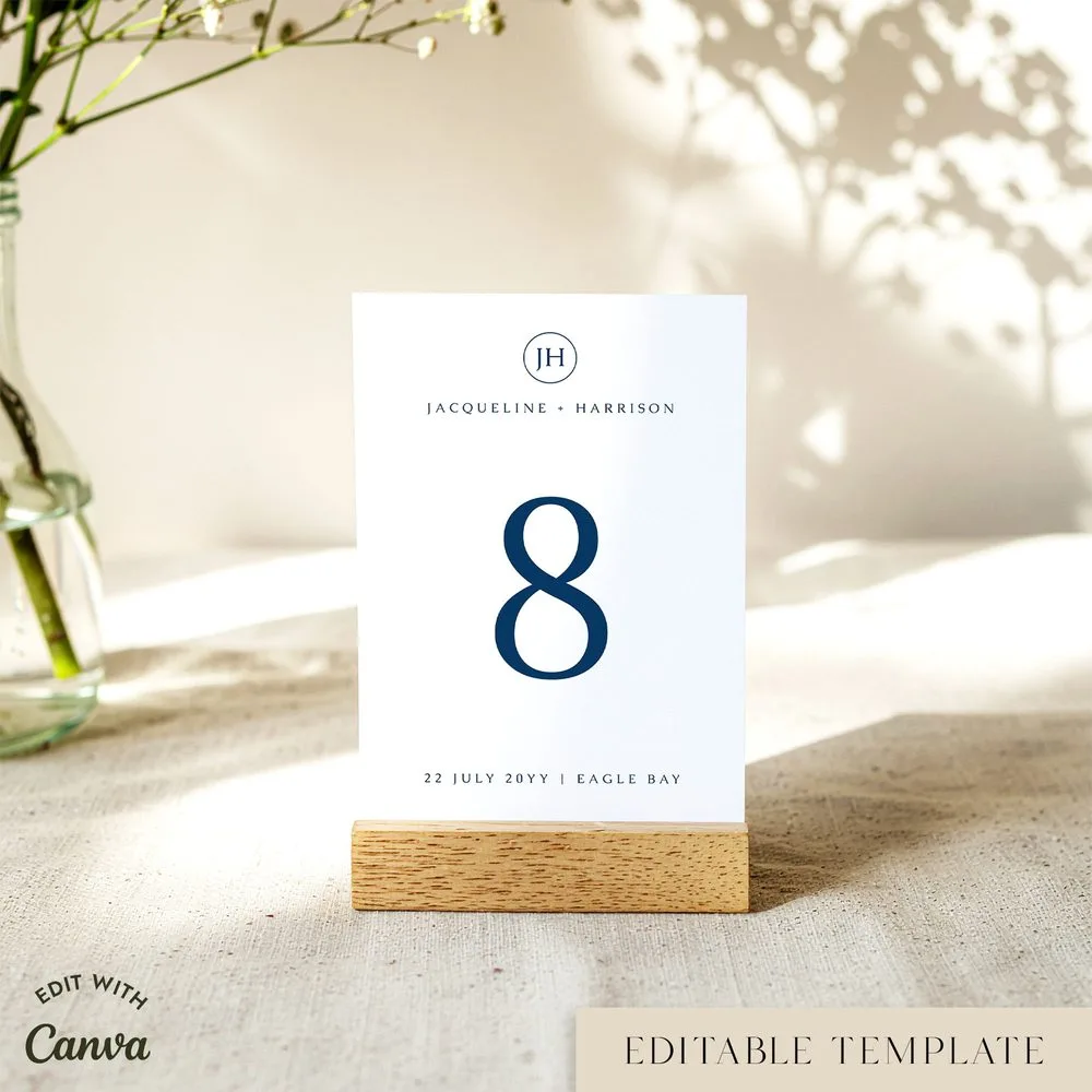 Customisable blue modern wedding table number in a wooden stand on table