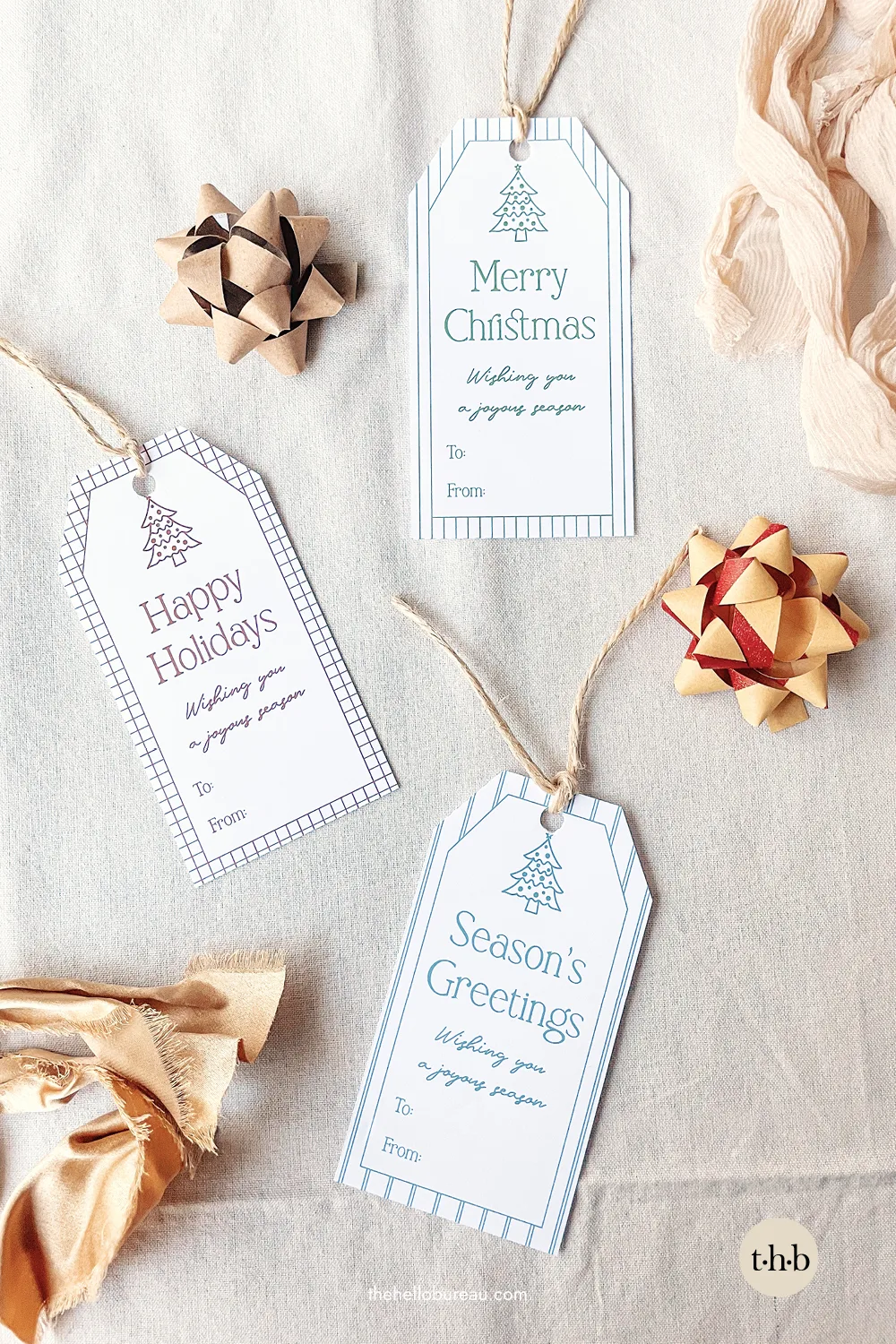 Merry Christmas and Happy Holidays gift tags styled with kraft bows
